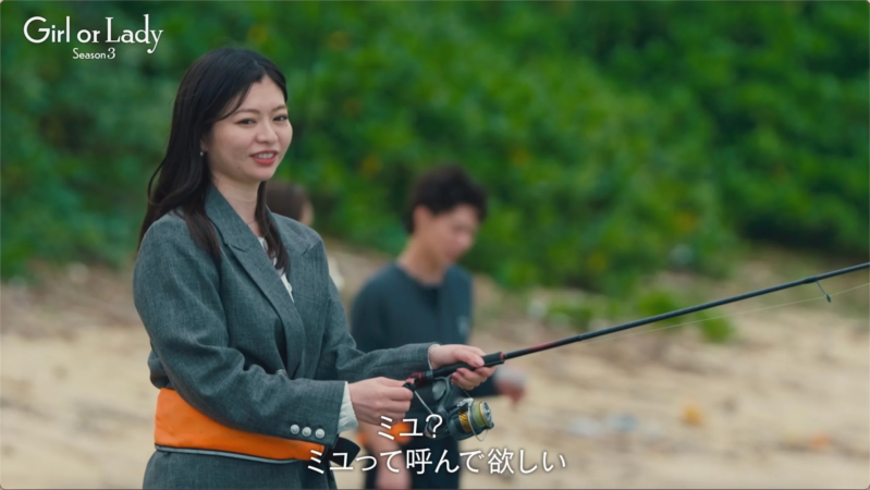 釣り竿を持つ女性